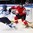 MINSK, BELARUS - MAY 16: Switzerland's Etienne Froideveaux #40 attempts to play the puck while Finland's Ville Lajunen #47 defends during preliminary round action at the 2014 IIHF Ice Hockey World Championship. (Photo by Andre Ringuette/HHOF-IIHF Images)

